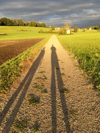 Field against cloudy sky