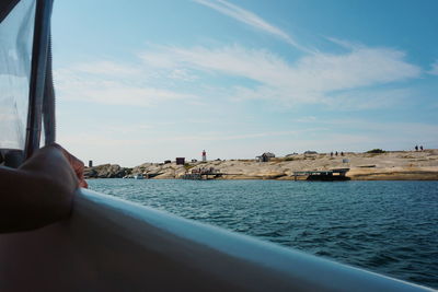 View of beach seen through boat against sky