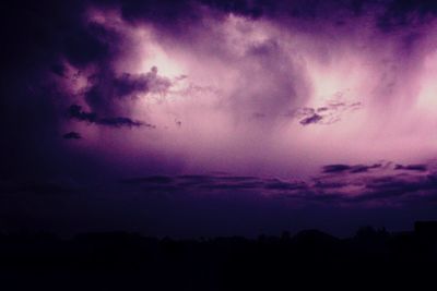 Low angle view of dramatic sky at sunset