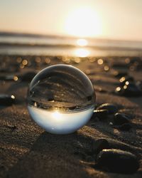 Close-up of crystal ball on water