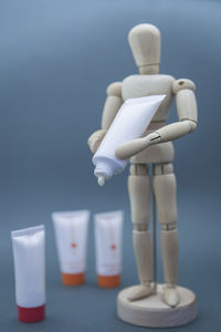 Close-up of white figurine on table