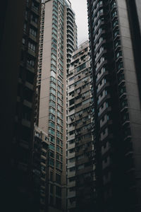 Low angle view of modern buildings in city against sky