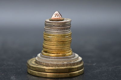 Close-up of coin stack on table