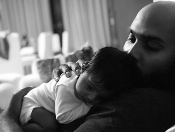 Close-up of father and daughter at home