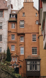 Low angle view of old building near edinburgh castle, ramsay garden, edinburgh, scotland, uk