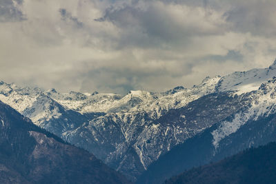 Snow covered mountains against sky