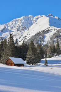 Scenic view of snowcapped mountains against clear sky