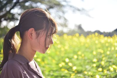 Portrait of woman on field