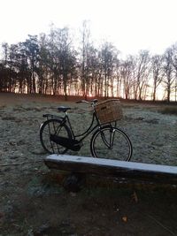 Bicycle on field against sky