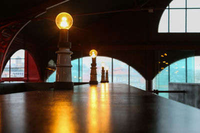 Illuminated lights on bridge in building