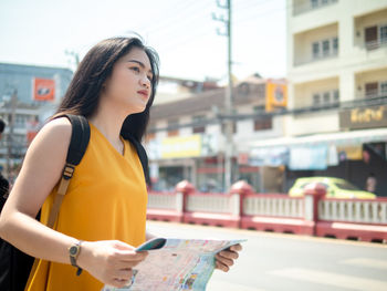 Young woman looking at city