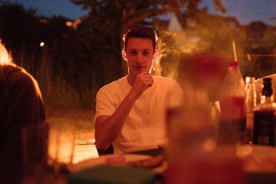 Portrait of man sitting outdoors