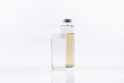 Close-up of glass bottle against white background