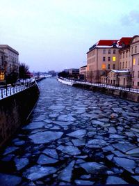 View of canal along buildings