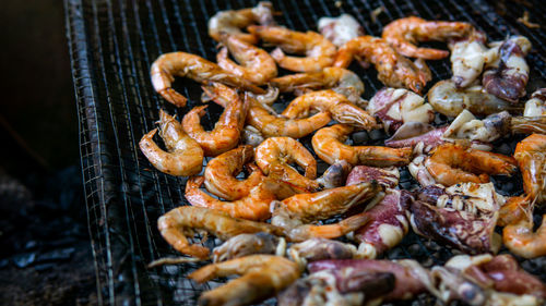 High angle view of meat on barbecue grill