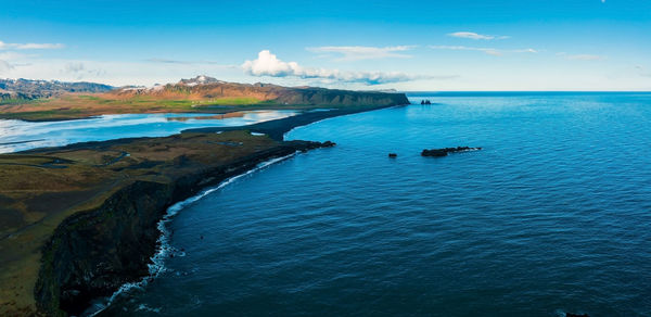 Aerial view of the iceland coastline by the black beach.