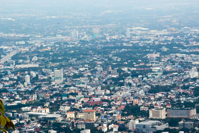 High angle view of buildings in city against sky