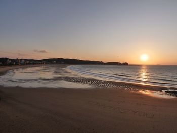 View of beach at sunset