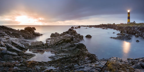 Scenic view of sea against sky during sunset