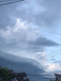 Low angle view of cables against sky