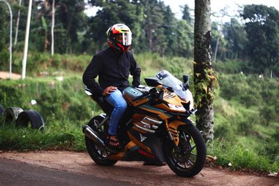 Man riding motorcycle on road