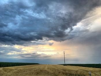 Scenic view of field against sky during sunset