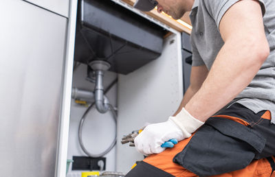 Low section of man working in factory