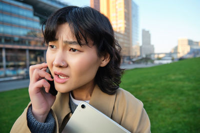 Young woman using mobile phone