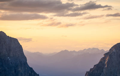 Scenic view of mountains against sky during sunset