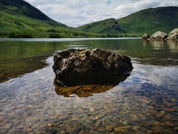 Scenic view of rocks in lake