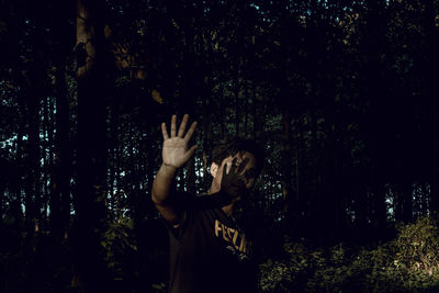 Man standing in forest