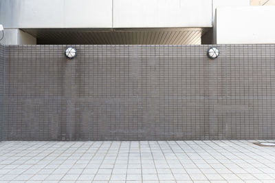 Ball on tiled floor against wall