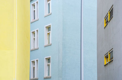 View of yellow and blue buildings close to each other