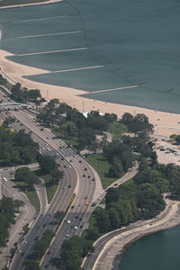 High angle view of highway amidst trees in city