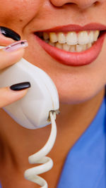 Close-up of woman using telephone