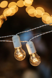 Close-up of illuminated light bulb