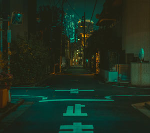 Illuminated road sign at night