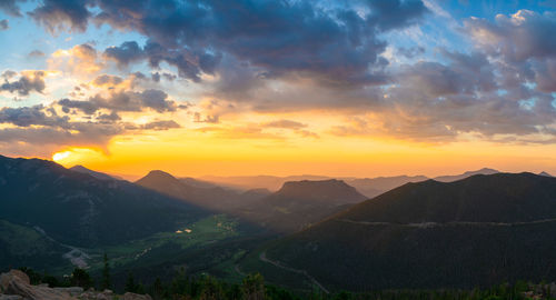 Scenic view of mountains against dramatic sky