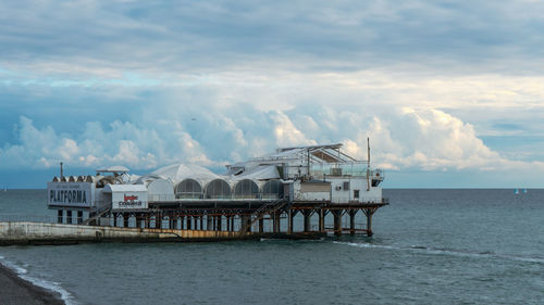 Pier over sea against sky