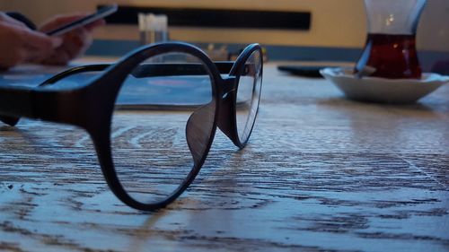 Close-up of eyeglasses on table