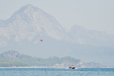 Scenic view of sea against mountains