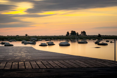 Scenic view of lake against sky during sunset