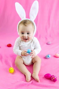 Portrait of cute girl playing with toys