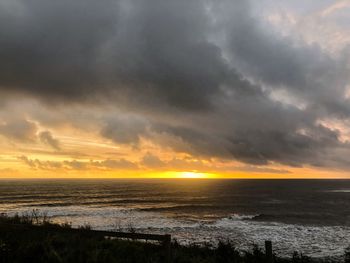 Scenic view of sea against sky during sunset