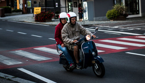 Man riding motorcycle on road