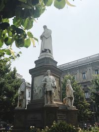 Low angle view of statue against sky