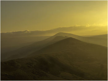 Scenic view of landscape against sky during sunset