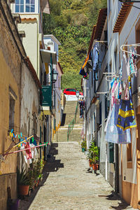 Narrow alley amidst buildings in city