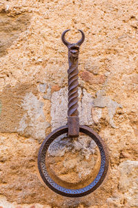 Close-up of rusty metal against wall