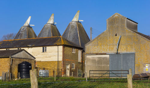 Exterior of old building against clear blue sky